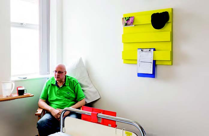 Patients at Bristol Haematology & Oncology Centre use yellow sculptures to store personal items.