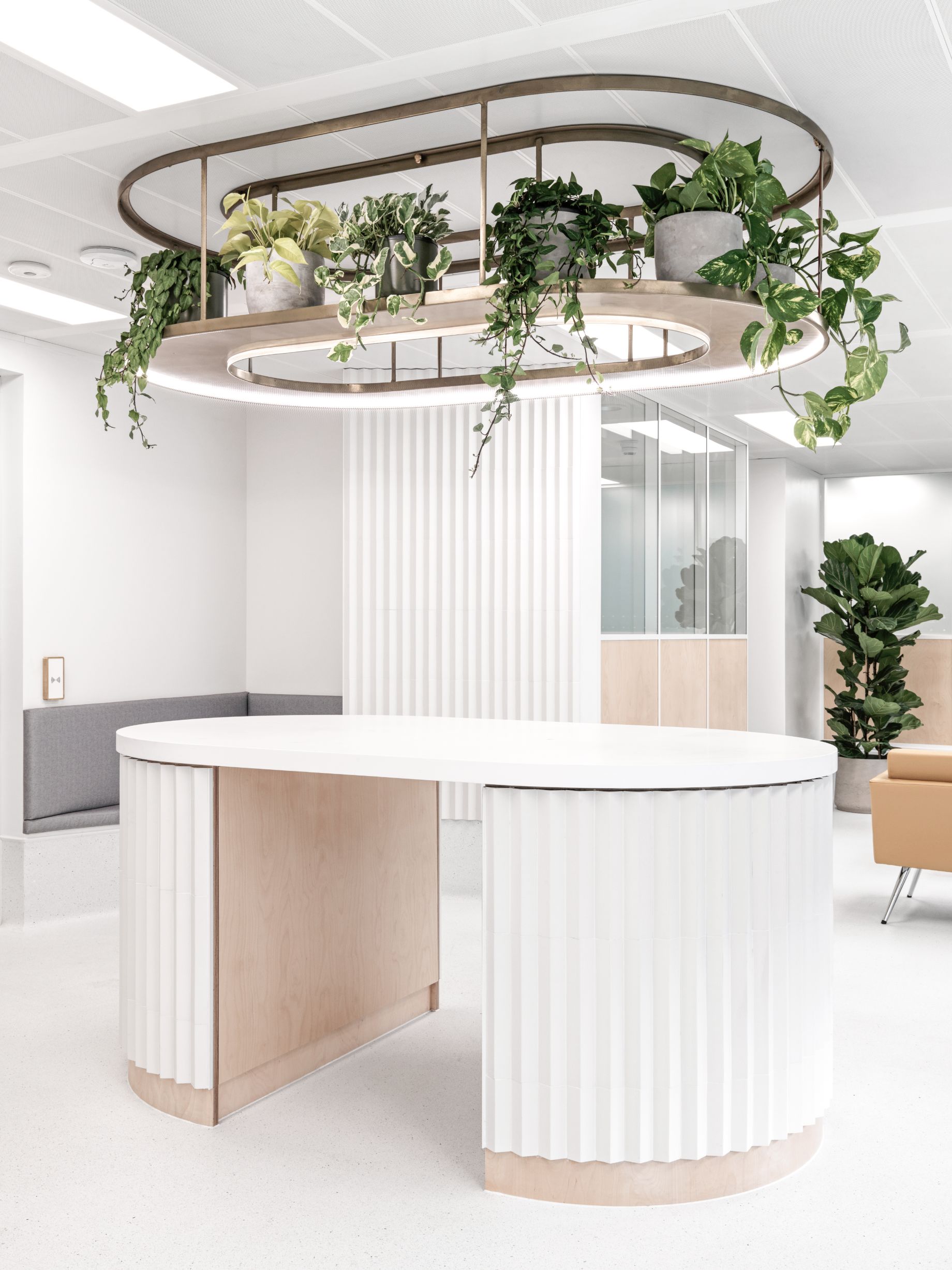 The traditional reception desk and plastic chairs have been replaced by a wide, open-plan space