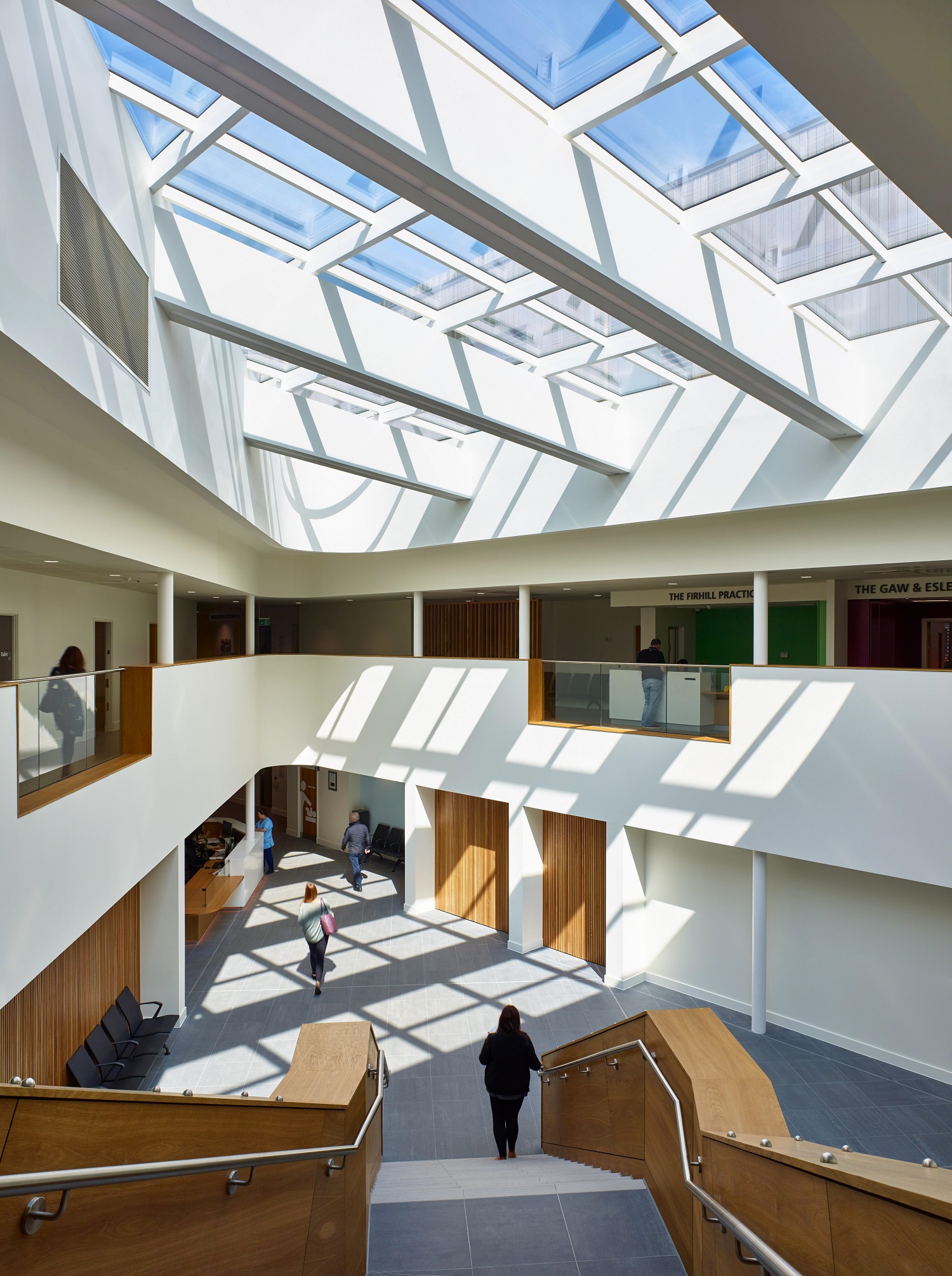 The first floor is orientated around a top-lit glazed central atrium