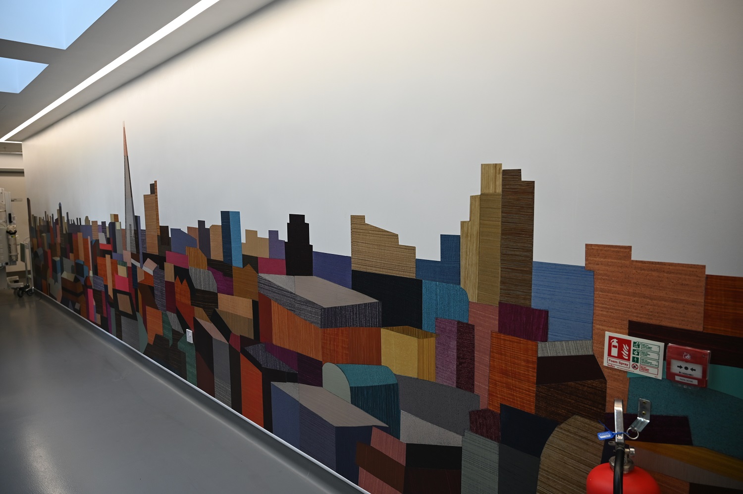 The London skyline brings colour to walls in the unit