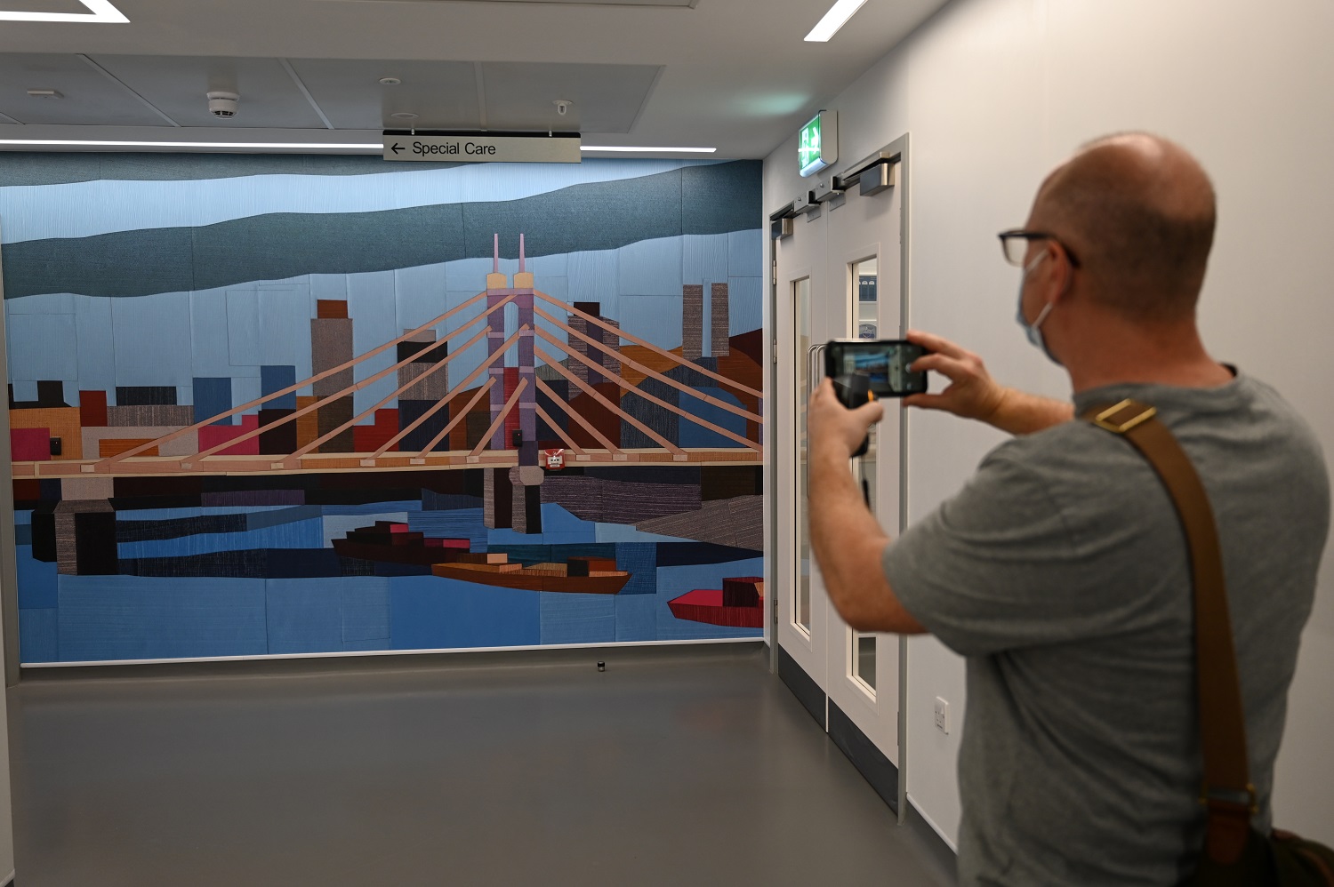 Burgess visited the hospital to view his works