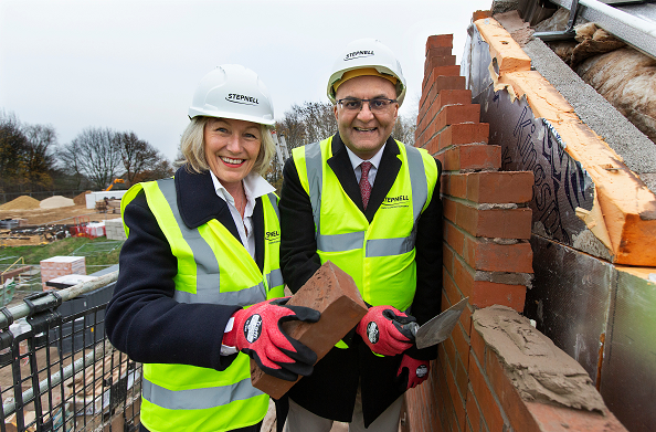 Beverley Webster and Atulkumar Patel laid the final brick to complete the building